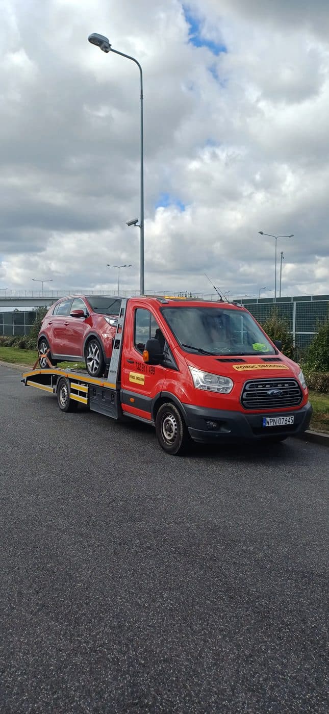 Laweta Lavet Transport z czerwoną Kią